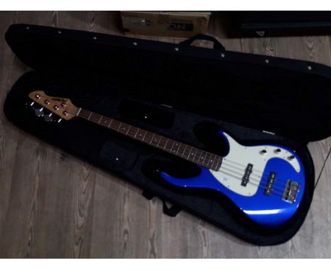 A Peavey Milestone III blue electric bass guitar, serial no. 11086909, with case.  