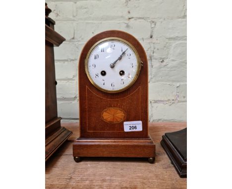 An Edwardian inlaid domed top mantle clock, French movement striking on single coil.Condition:- with key and pendulum, does n