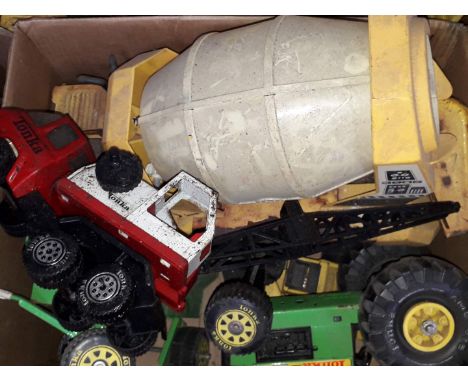 A selection of vintage Tonka toys to include tractor, cement mixer, etc.  