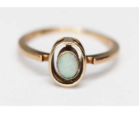 An opal ring marked '9ct', gross wt. 1.5g, size K.  