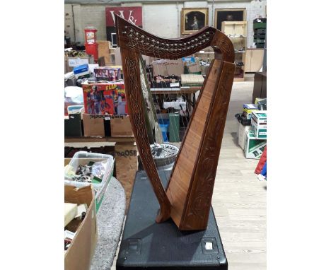 A 19 string small Celtic lap harp.  