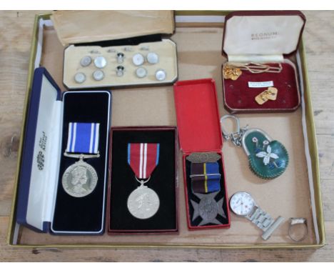 A collection of medals and collectables including a Lads Church Brigade 1919 medal, two commemorative royal medals, a boxed s