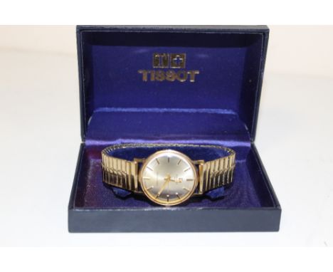 A 9 CARAT GOLD BOXED TISSOT SEASTAR SEVEN WRIST WATCH