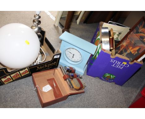 TWO BOXES OF MODERN HOUSEHOLD SUNDRIES TO INCLUDE A TABLE LAMP, MODERN WALL CLOCK ETC