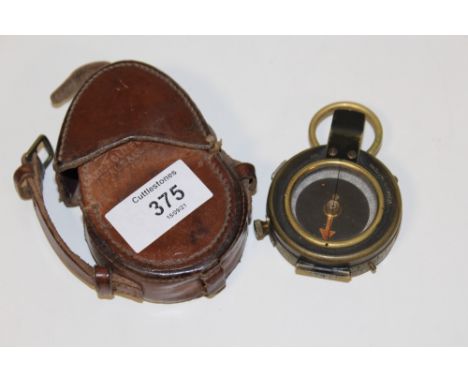 A LEATHER CASED MILITARY 1918 FIELD COMPASS