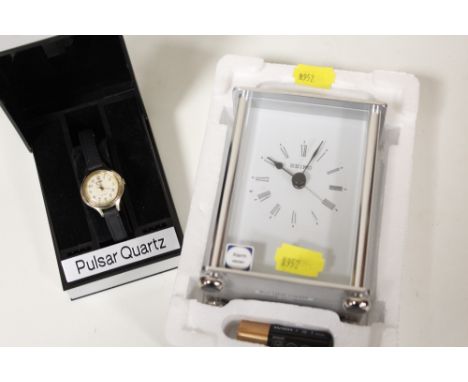 A CASED PULSAR WRIST WATCH, AND A CARRIAGE CLOCK (2)