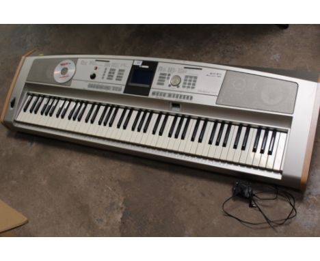 A YAMAHA DGX-505 PORTABLE MULTI EFFECTS GRAND KEYBOARD / PIANO WITH MEMORY CARD,MAINS ADAPTER AND USER MANUAL