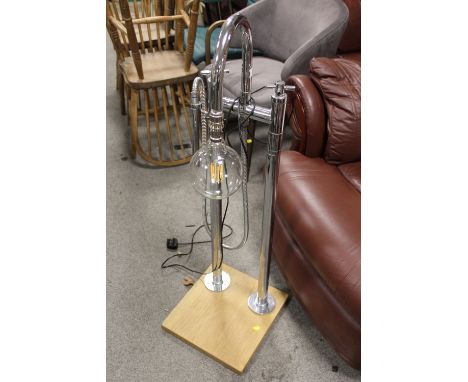 A NOVELTY FLOOR STANDING LAMP MADE FROM CHROME BATHROOM FITTINGS, H 107