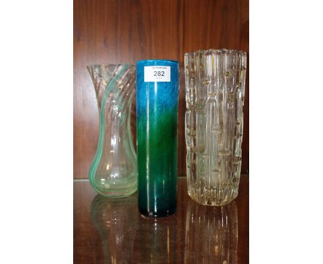 A SIGNED STUDIO GLASS CYLINDRICAL VASE TOGETHER WITH A CAITHNESS EXAMPLE AND ANOTHER (3)