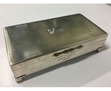 A silver plated engine turned cigarette box bearing inscription "Presented by the Makers of Senior Service Cigarettes".