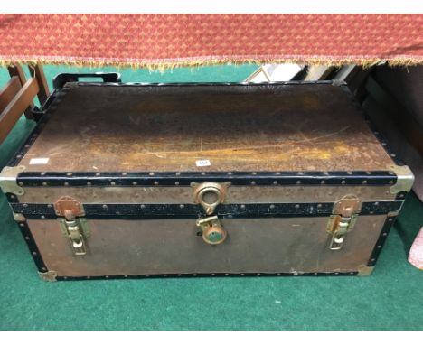 A trunk containing a quantity of various Military uniforms.