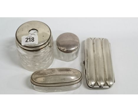 Three silver lidded glass dressing table jars together with an early 20th century silver plated three cigar case with engine 