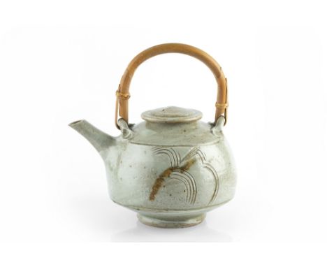 Jim Malone (b.1946) Teapot the body with combed motifs under ash glaze impressed potter's seal 27cm high (including cane hand