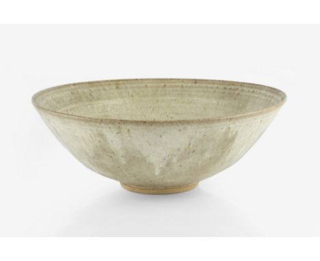 Emmanuel Cooper (1938-2012) Large bowl, circa 1970 light running glaze over oatmeal ground impressed potter's seal 36cm diame