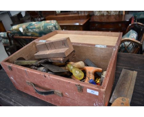 A vintage wooden tool box and contents