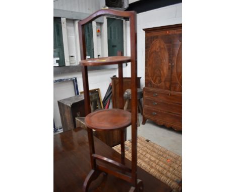 An early 20th Century mahogany three tier cake stand , approx. height 88cm, no hinge for bottom shelf