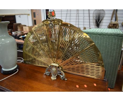 A vintage brass firescreen of fan form , having 9 sections