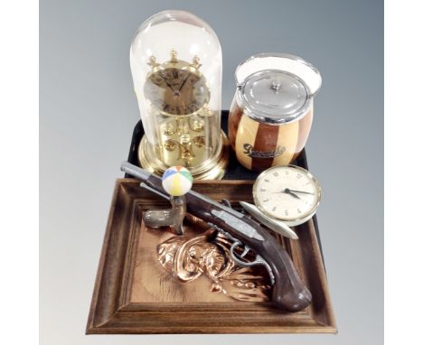 A tray of Schatz anniversary clock under dome, treen biscuit barrel, mid 20th century alarm clock, replica flintlock pistol, 