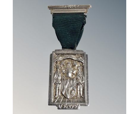 A silver medal the First Grand Mason of Scotland, 1736, on ribbon 