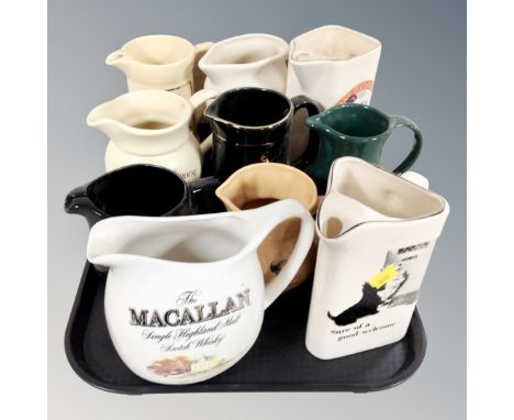 Ten ceramic jugs bearing brewery advertising 