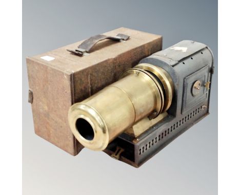 An antique Magic Lantern in tin case 