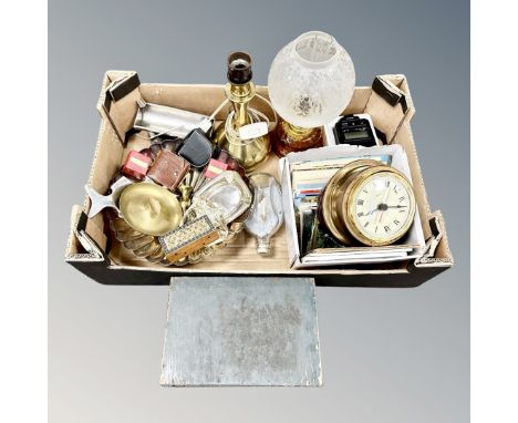 A box of assorted metal wares, ship in whiskey bottle, ship's style wall clock, barometer, postcards etc 