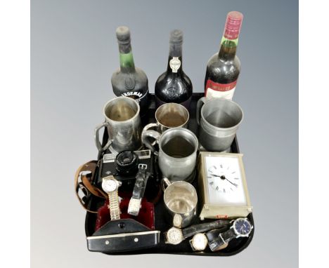 A tray of three bottles of sherry and port, pewter and plated tankards, Gent's watches, carriage clock