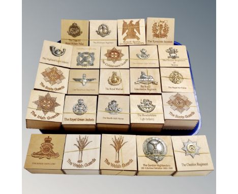 Twenty-four wooden lidded trinket boxes, bearing military badges 
