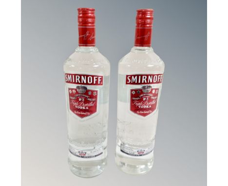 Two bottles of Smirnoff vodka, one litre, sealed 