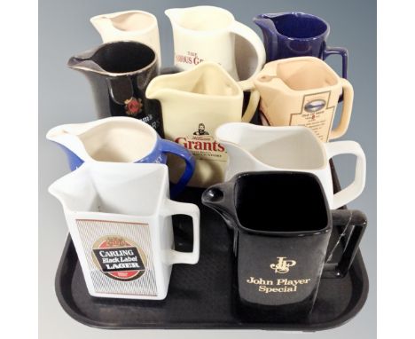 Ten ceramic jugs bearing brewery advertising 