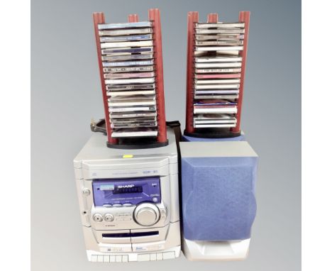 A Sharp 3 disk rotary changer hi/fi system with leads and remote, two stands containing CDs 
