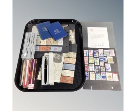 A tray of stamps and transport tickets on card, cased pens with include Parker, Britains first decimal coin sets, Queen Eliza