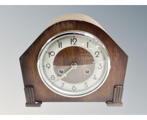 An Art Deco oak eight day mantel clock. 