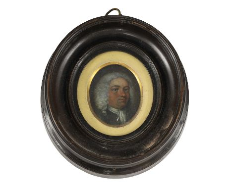 Follower of William Hogarth Portrait of a gentleman, bust-length, in a blue coatminiature on copper, oval4.5 x 4cmCondition R