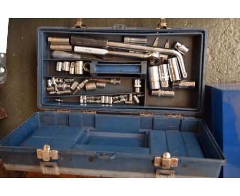 A plastic toolbox with internal trays containing a variety of tools including socket sets, hammer and chisels