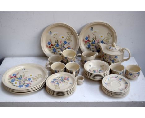 A Poole Pottery 'Springtime' part tea service including plates, teapot, cups, saucers