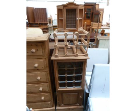 A pine cupboard with twelve bottle integral wine rack over a cupboard, a pine corner shelf unit, a pine six bottle wine rack 