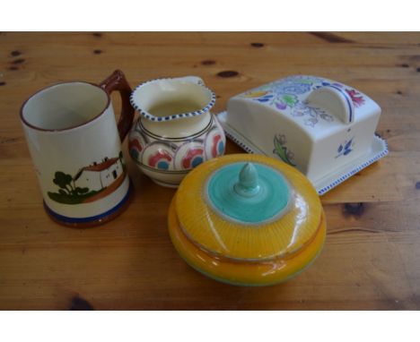 A quantity of china including Wade, Prinknash, Goebel figurines, and Poole Pottery