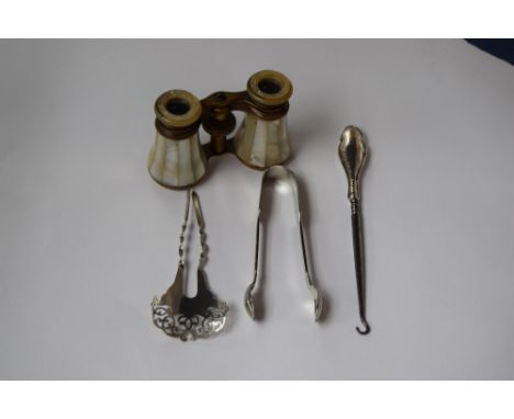 A pair of 20th century mother of pearl opera glasses, a silver and steel button hook, a pair of plated sugar tongs and an Edw