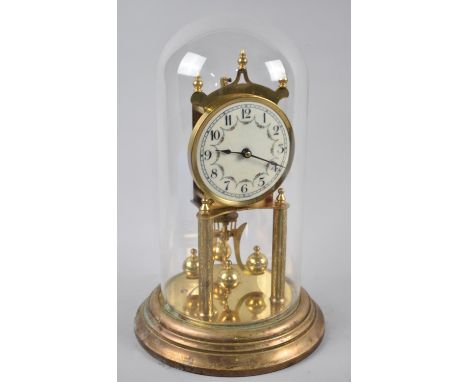A Mid 20th Century Brass Pillar Clock under a Glass Dome, 31cms High 