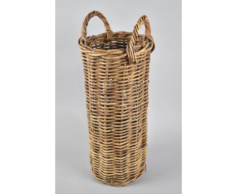 A Cylindrical Wicker Stick Stand with Two Carrying Handles, 24cms Diameter and 60cms High 