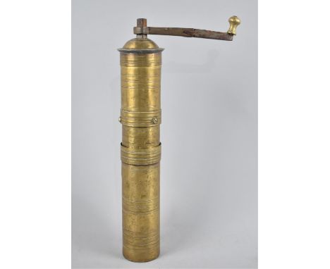 A Cylindrical Brass Coffee Grinder, Bottom Plate Stamped 1714, 33cms Long 