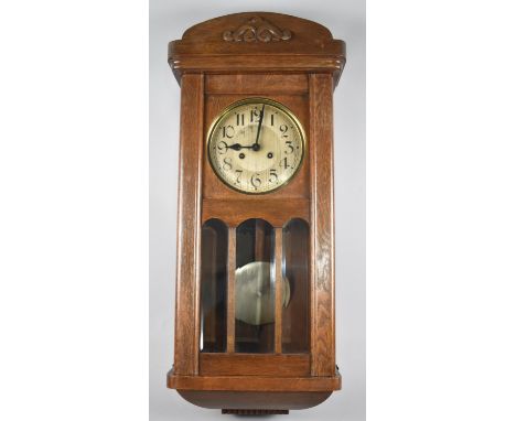 An Edwardian Oak Wall Clock 