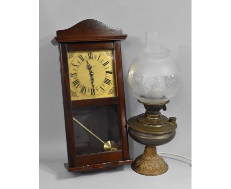 A Mahogany Cased Wall Clock together with a Converted Oil Table Lamp with Globular Shade and Chimney 