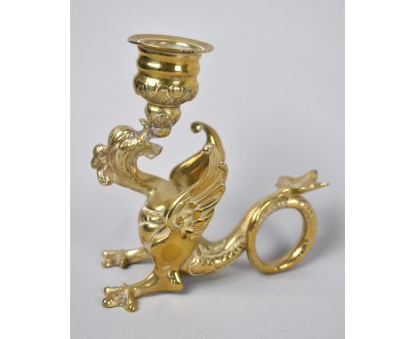 A Novelty Brass Bedchamber Stick in the Form of a Winged Dragon with Scrolled Tail as Handle, 12cms High 