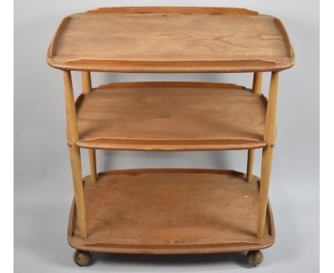 A Vintage Ercol Three Tier Beech and Elm Tea Trolley, 77cms Long 