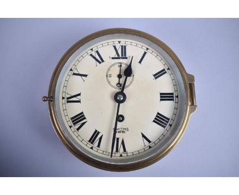 A Bulkhead Mounting Circular Brass Cased Ships Clock, Smiths Empire, 17cms Diameter 