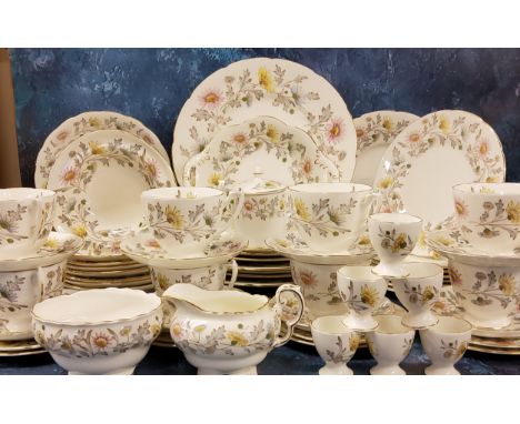 A Coalport dinner and tea service, for eight, comprising dinner, dessert and side plates, seven cups, saucers, six bowls, mil