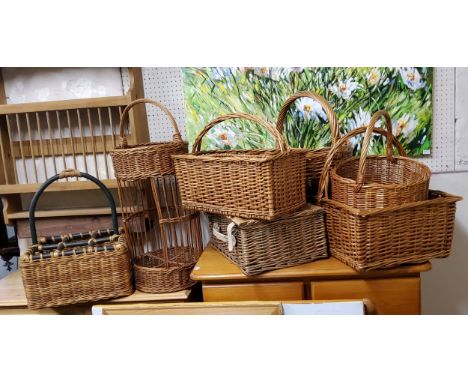 A collection of farmhouse wicker baskets including picnic hamper, wine basket, etc 