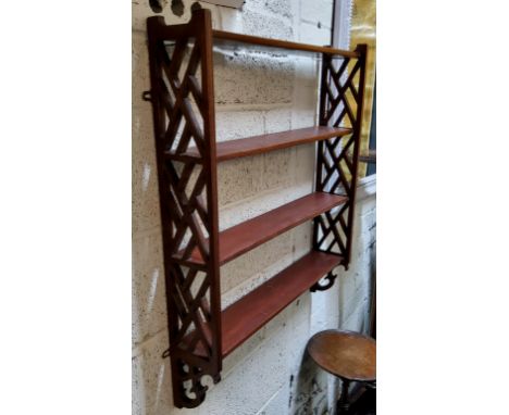 A 19th century mahogany display shelf, pierced fretwork supports c.1850 